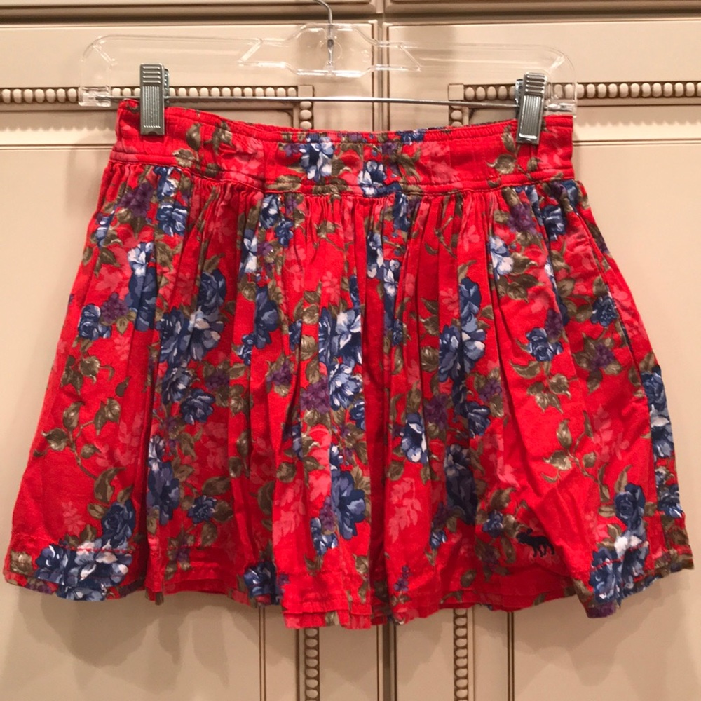 Hollister Red skirt with blue and white flowers.